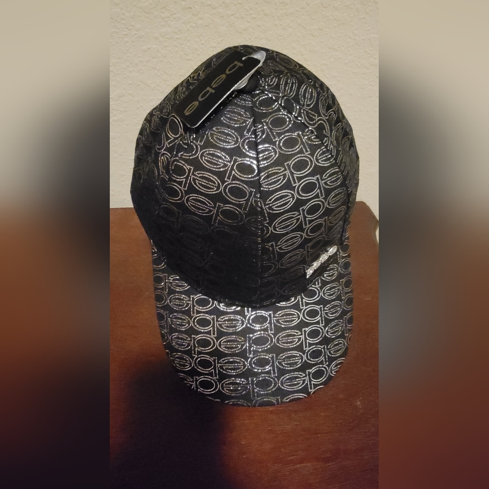 (NWT) bebe Black Cap with Silver Logo Pattern